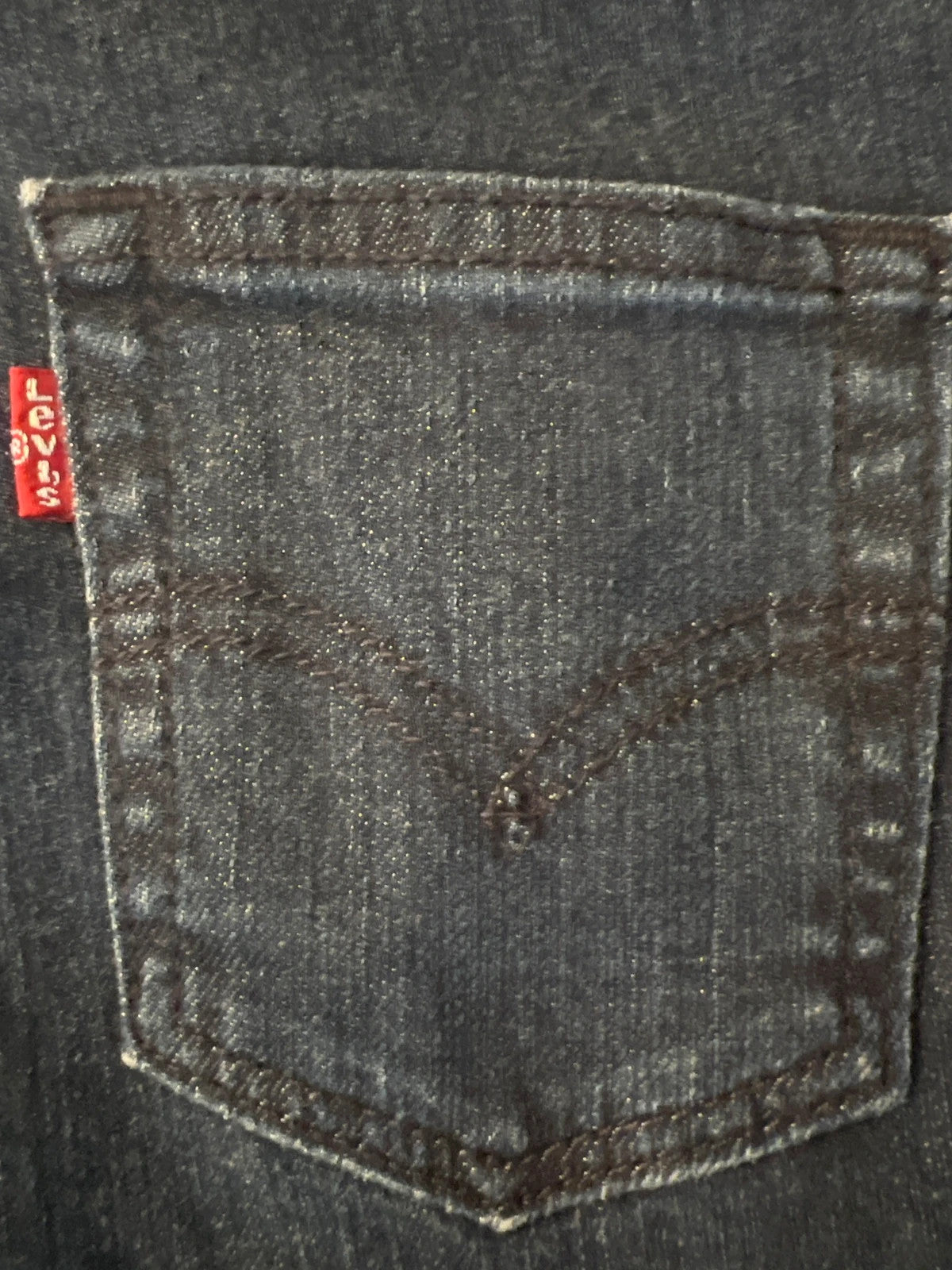 Levi's navy straight jeans with classic 505 logo and denim material.