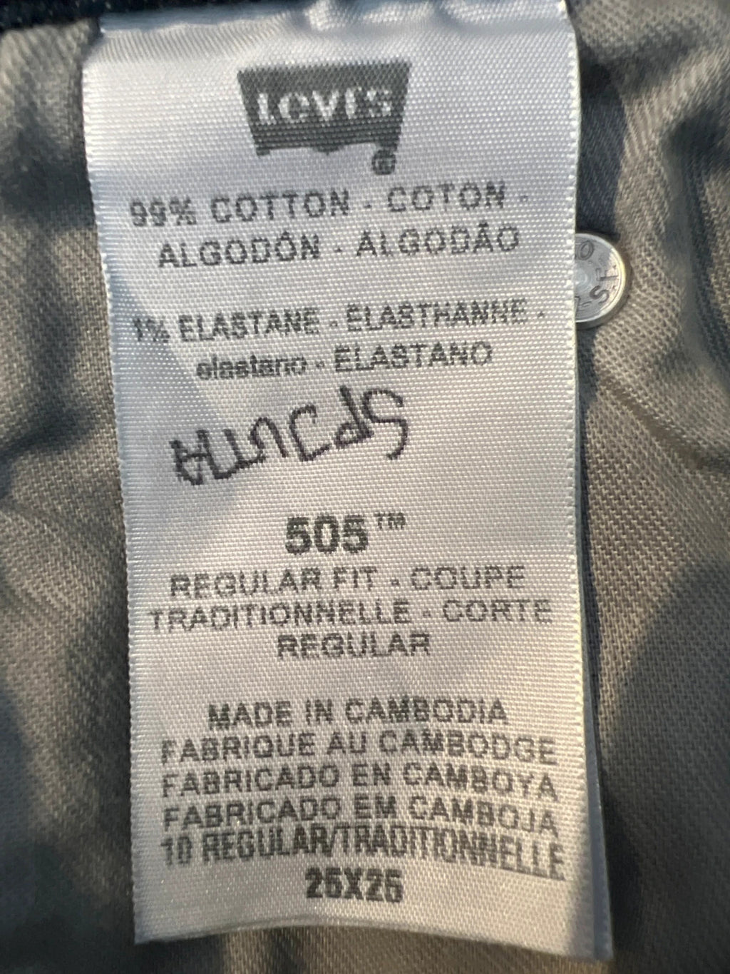 Levi's navy straight jeans with classic 505 logo and denim material.