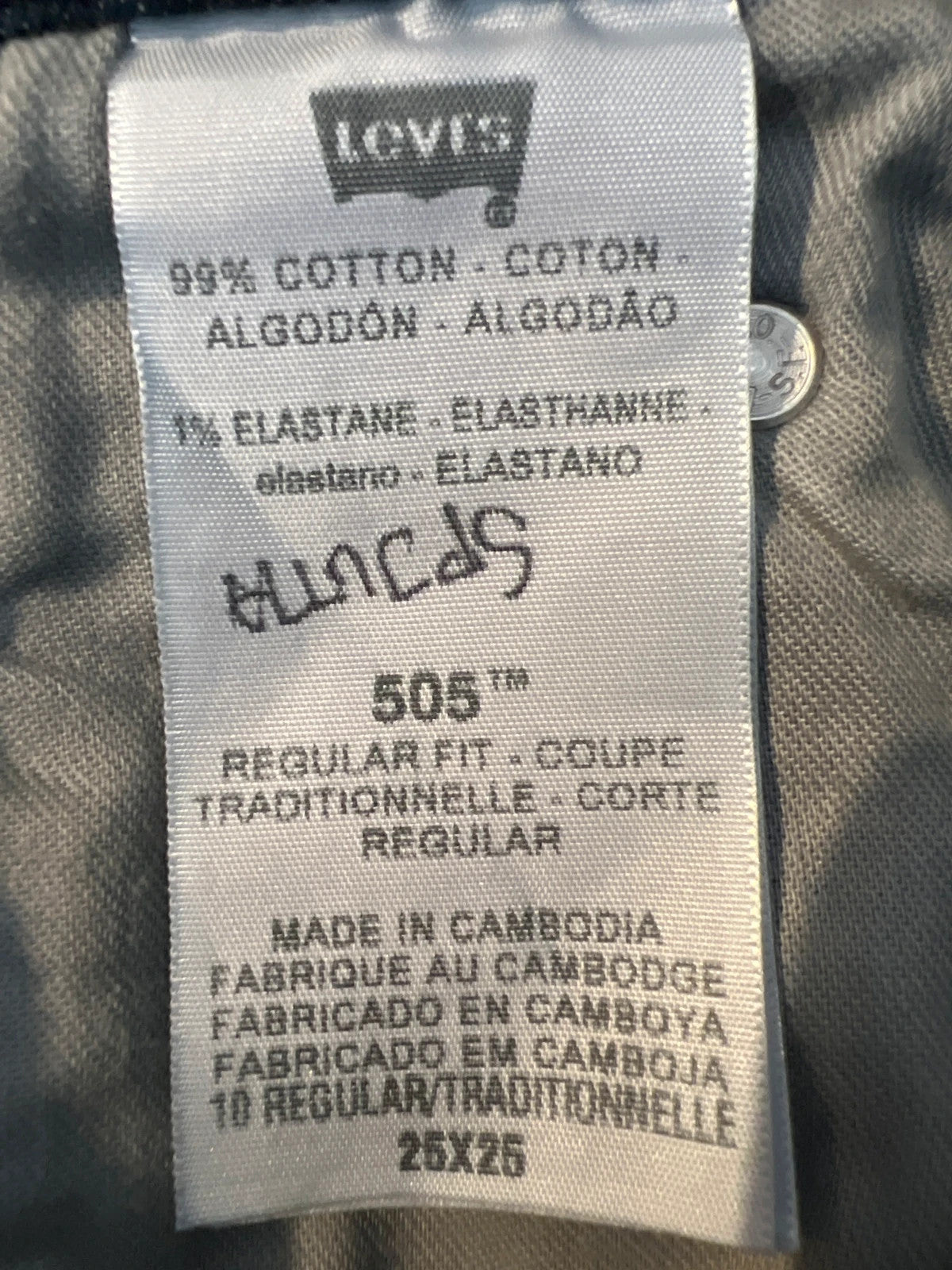 Levi's navy straight jeans with classic 505 logo and denim material.