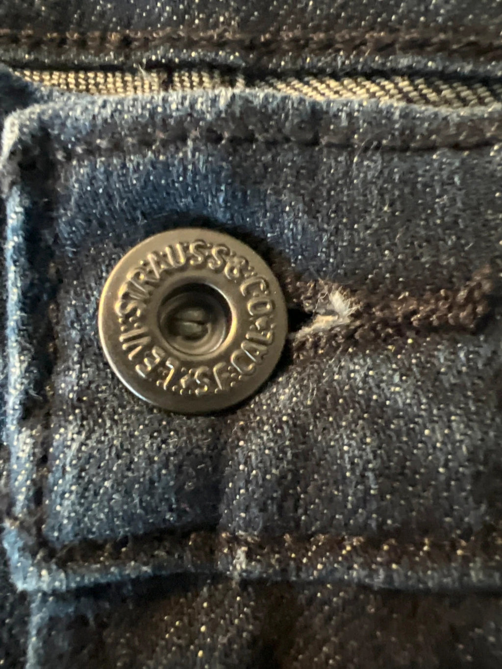 Levi's navy straight jeans with classic 505 logo and denim material.