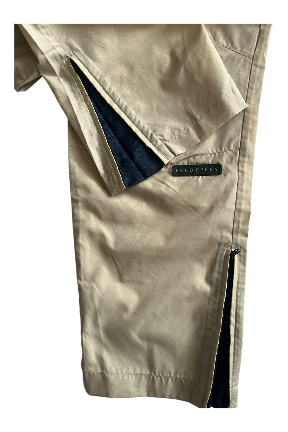 Fred Perry beige wide-leg trousers 100% nylon with logo detail.