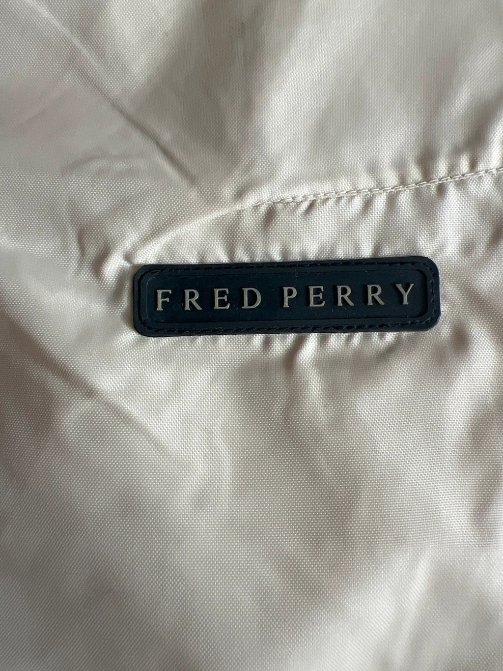 Fred Perry beige wide-leg trousers 100% nylon with logo detail.