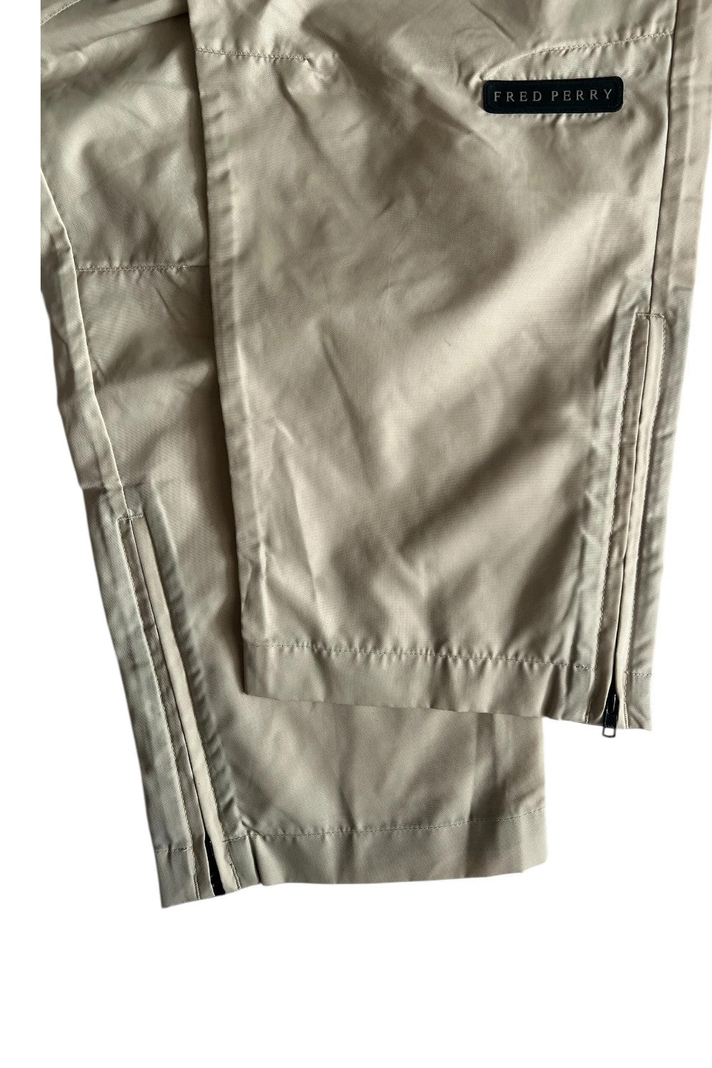 Fred Perry beige wide-leg trousers 100% nylon with logo detail.