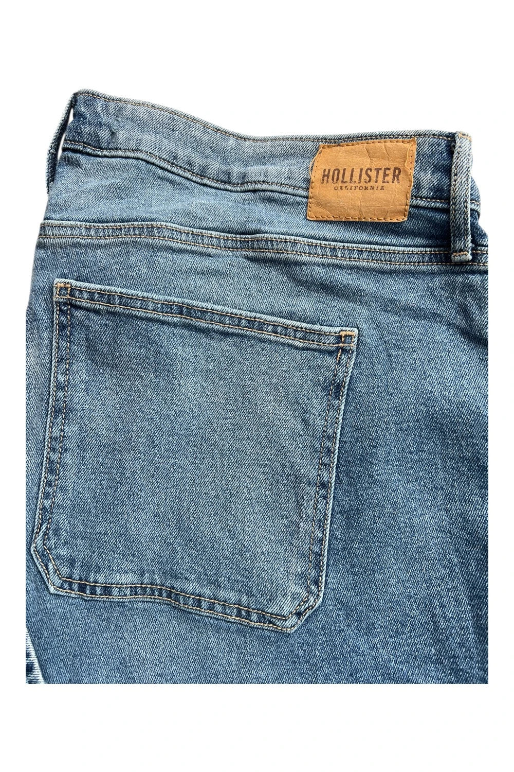 Hollister blue straight jeans relaxed fit vintage baggy style with casual denim texture.