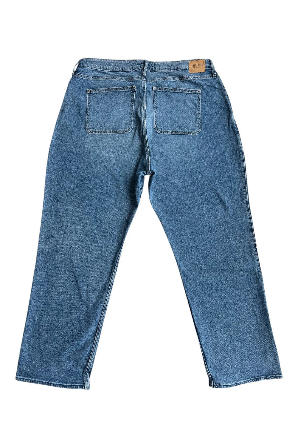 Hollister blue straight jeans relaxed fit vintage baggy style with casual denim texture.