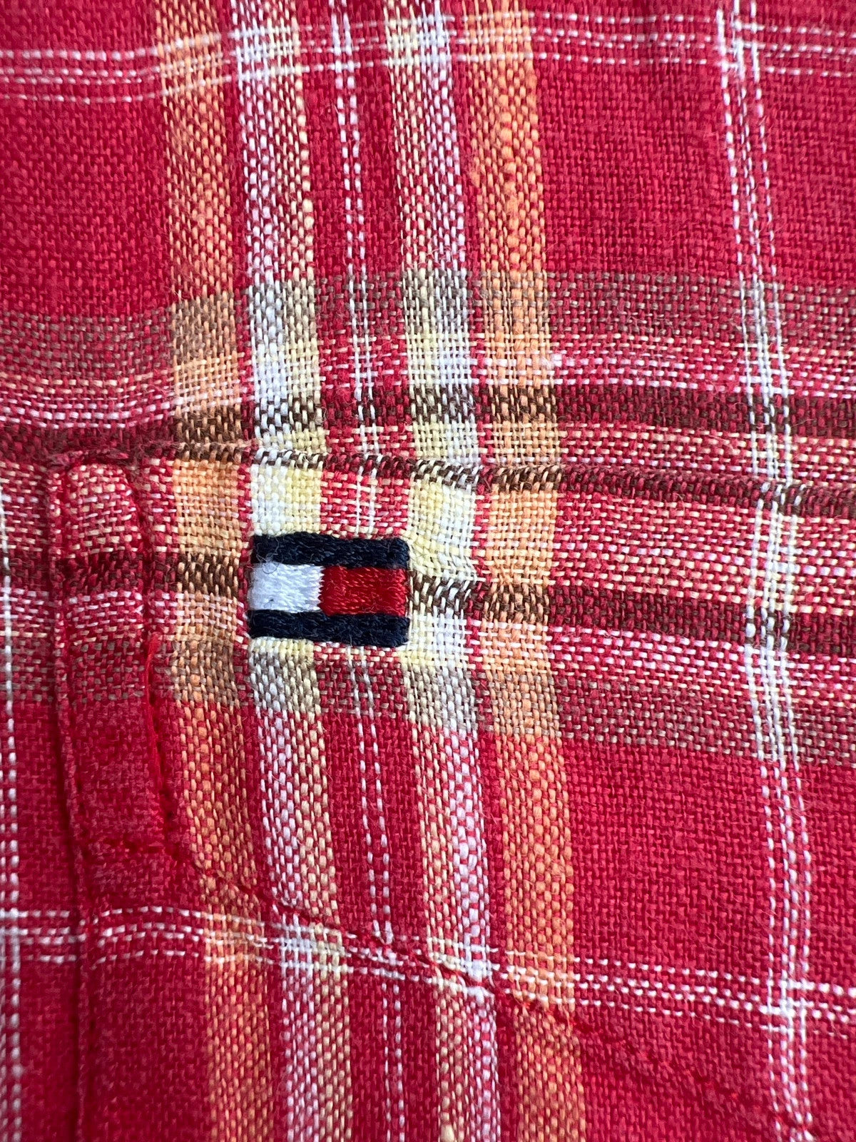 Tommy Hilfiger red short-sleeve button-down shirt with checkered pattern and linen material.
