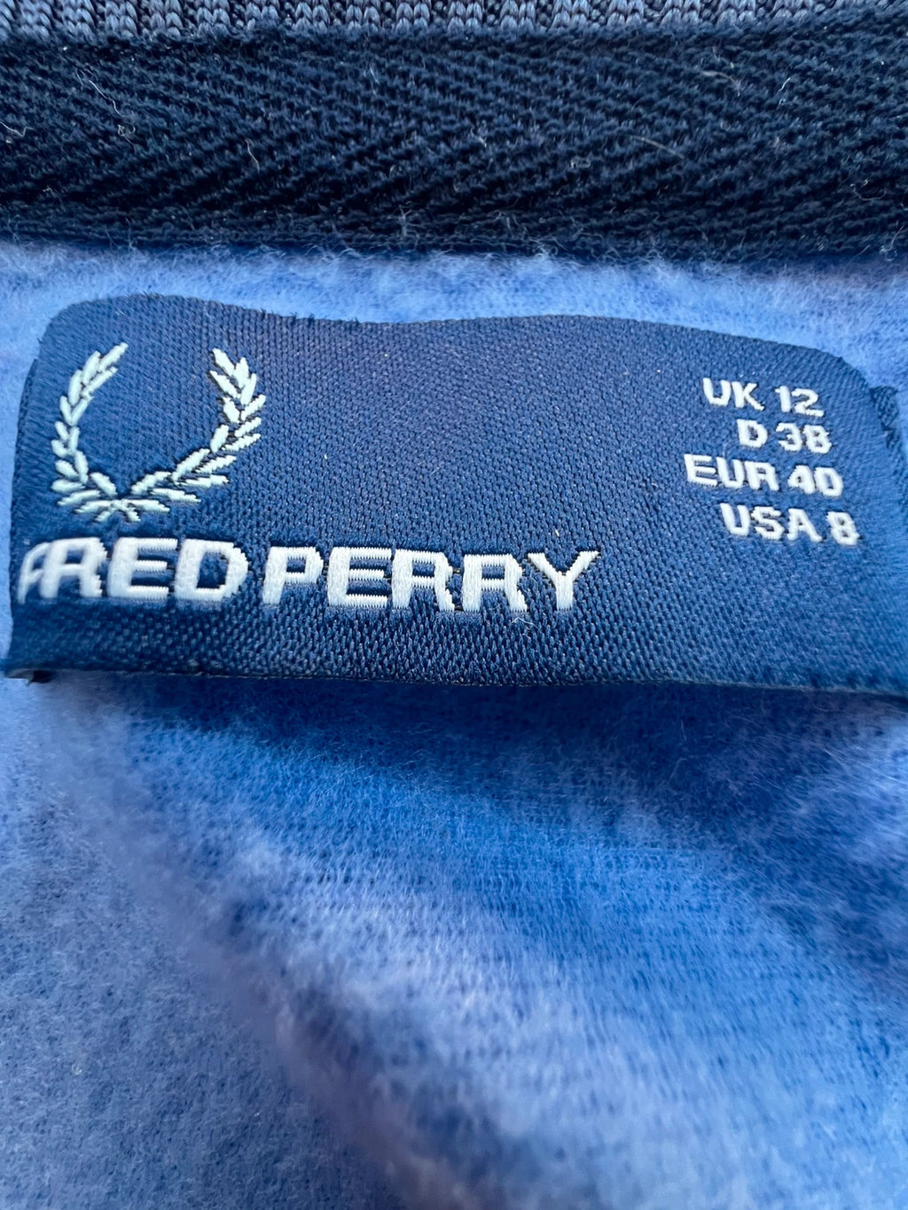 Fred Perry blue Y2K sporty jacket with logo detail and vintage track design.
