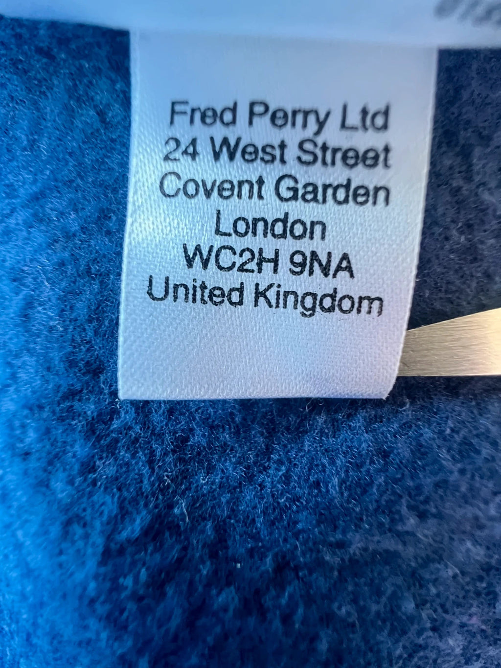 Fred Perry blue Y2K sporty jacket with logo detail and vintage track design.