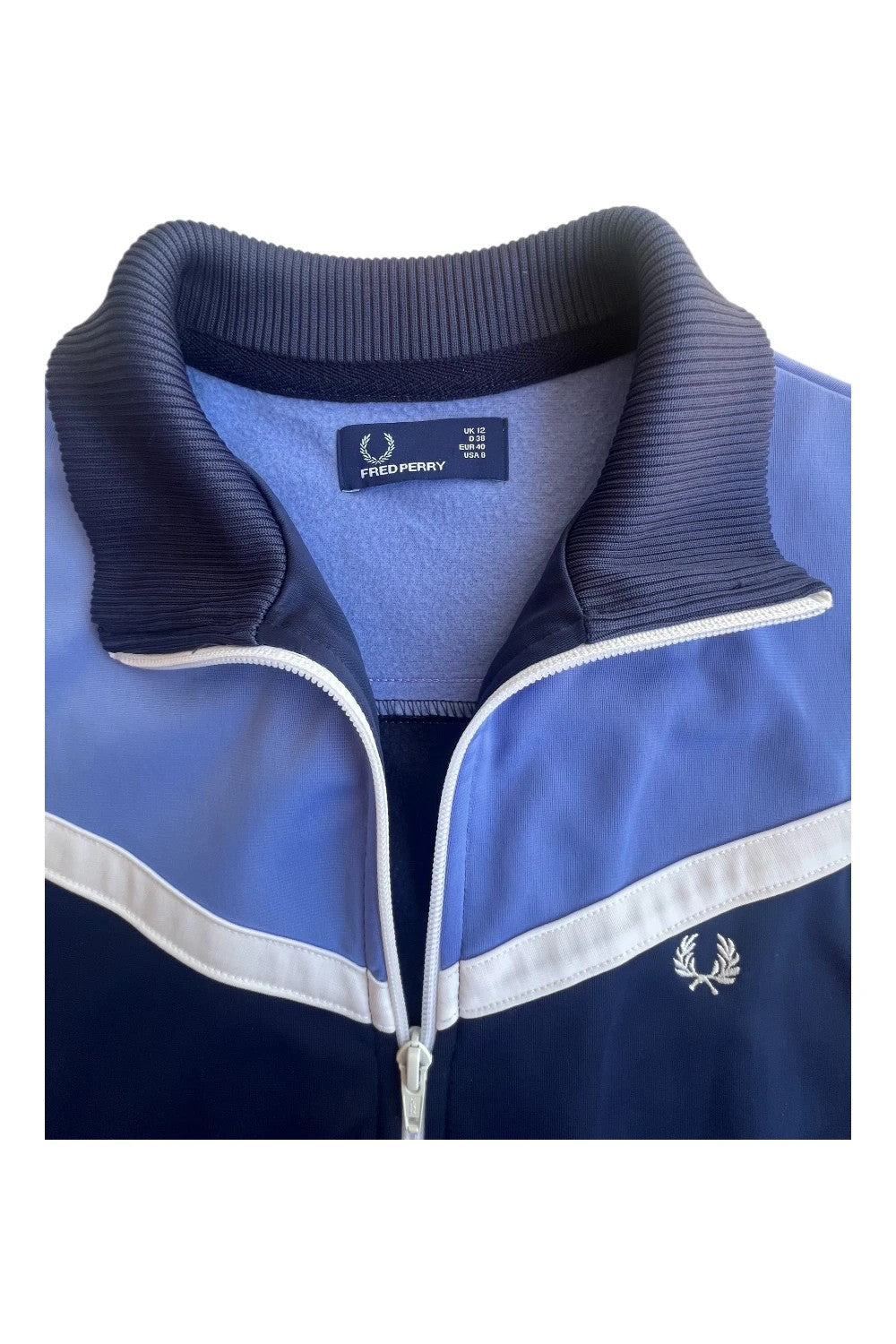 Fred Perry blue Y2K sporty jacket with logo detail and vintage track design.