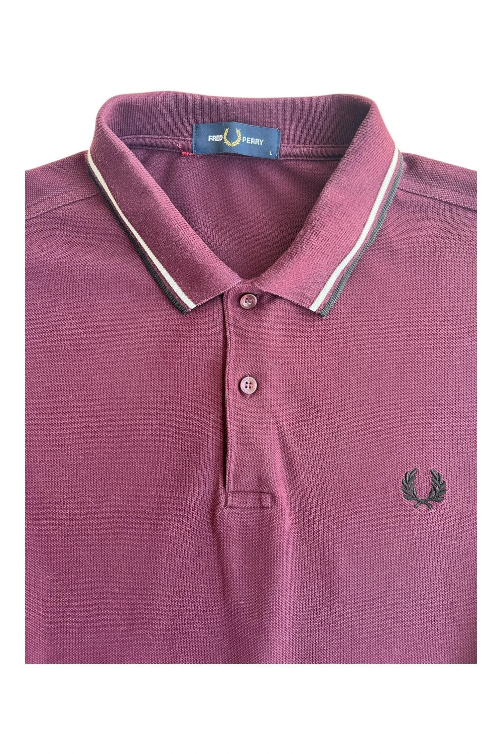 Fred Perry purple long sleeve polo shirt with classic logo and pique texture.