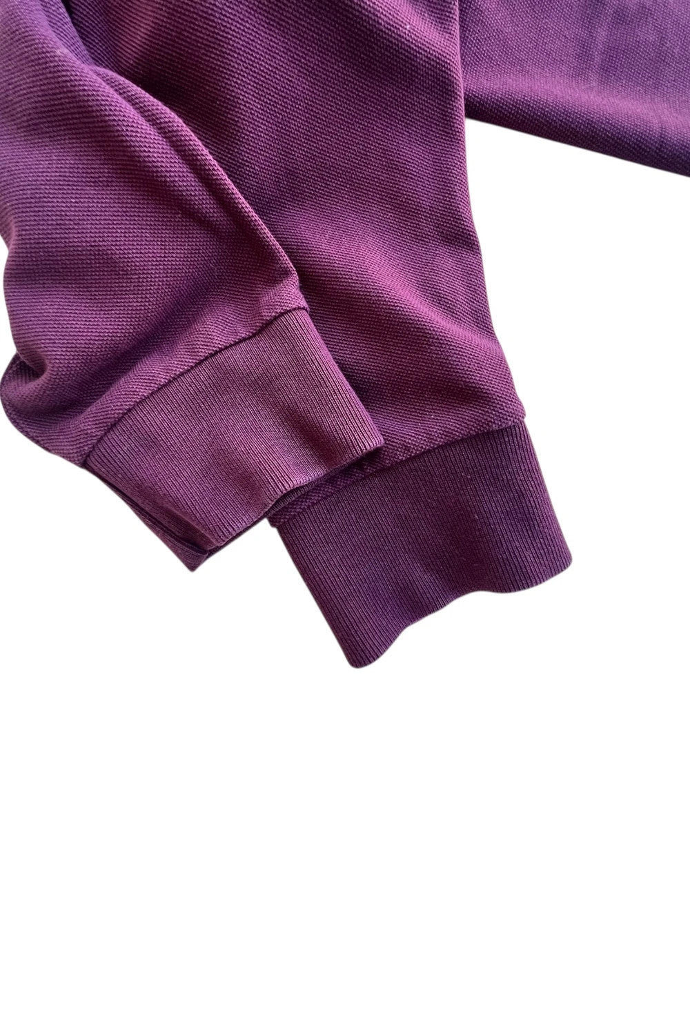 Fred Perry purple long sleeve polo shirt with classic logo and pique texture.
