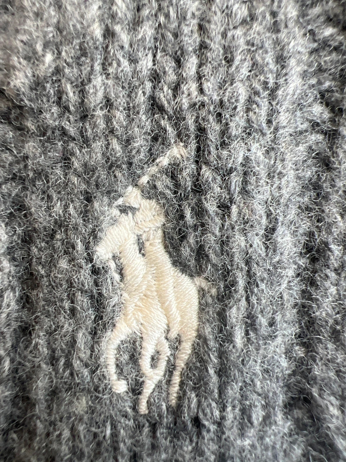 Ralph Lauren grey cable knit cashmere sweater with classic design and premium texture.