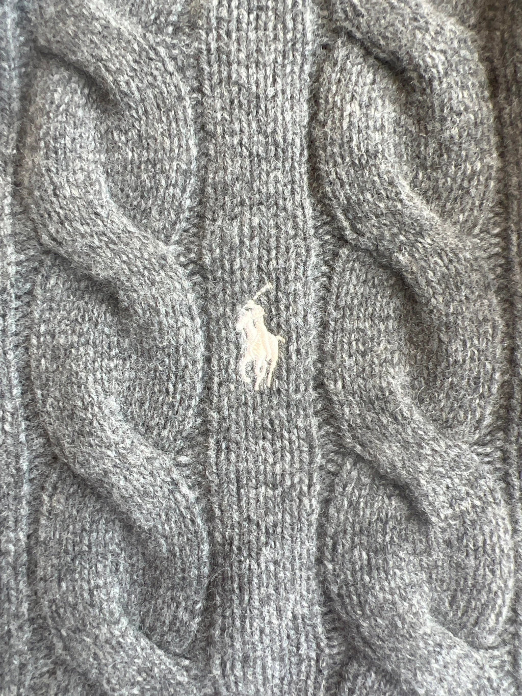 Ralph Lauren grey cable knit cashmere sweater with classic design and premium texture.