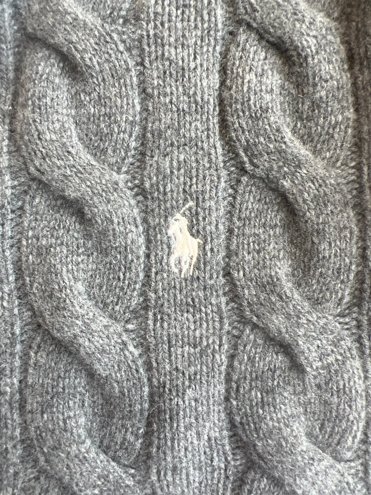 Ralph Lauren grey cable knit cashmere sweater with classic design and premium texture.
