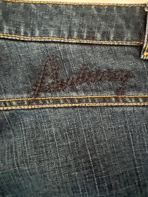 Burberry navy straight jeans with interior check pattern, slightly fitted, 100% cotton.