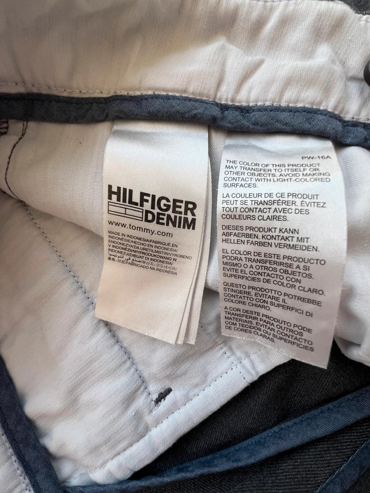 Tommy Hilfiger grey chino trousers with logo tag and soft fabric blend.