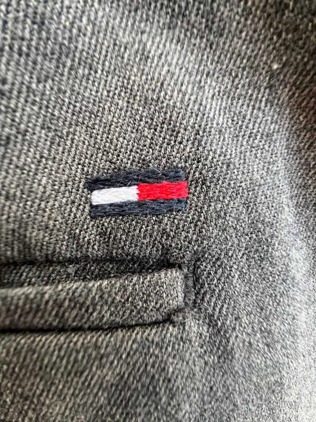 Tommy Hilfiger grey chino trousers with logo tag and soft fabric blend.
