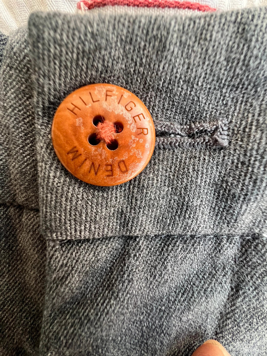 Tommy Hilfiger grey chino trousers with logo tag and soft fabric blend.