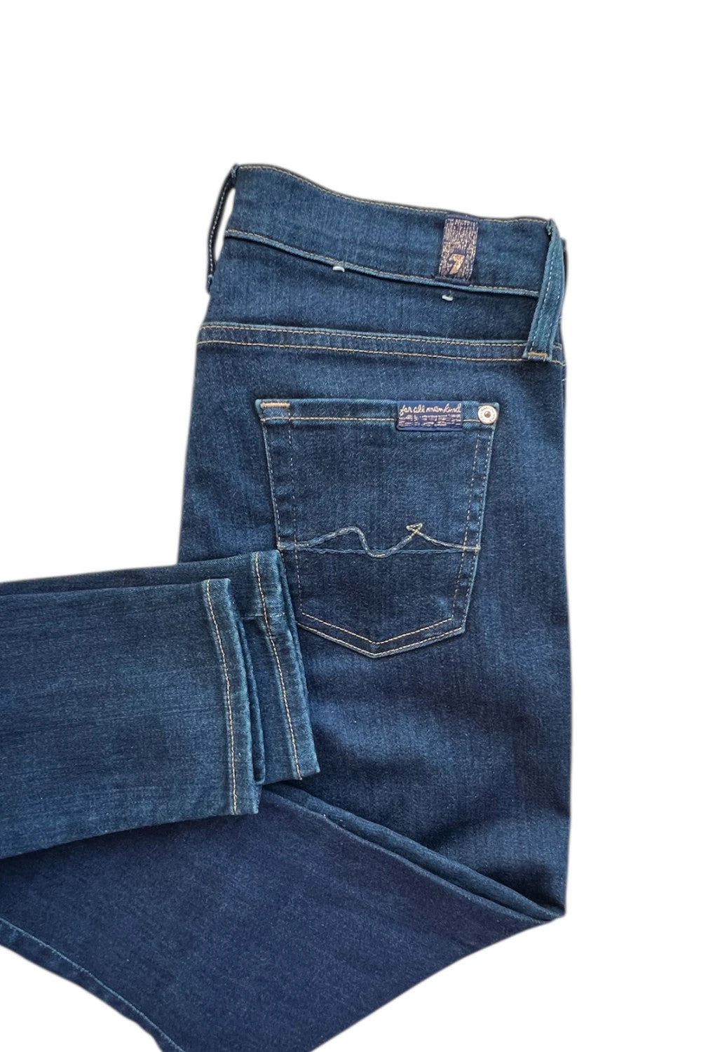 7 For All Mankind navy skinny jeans with elastic denim fabric and classic logo.