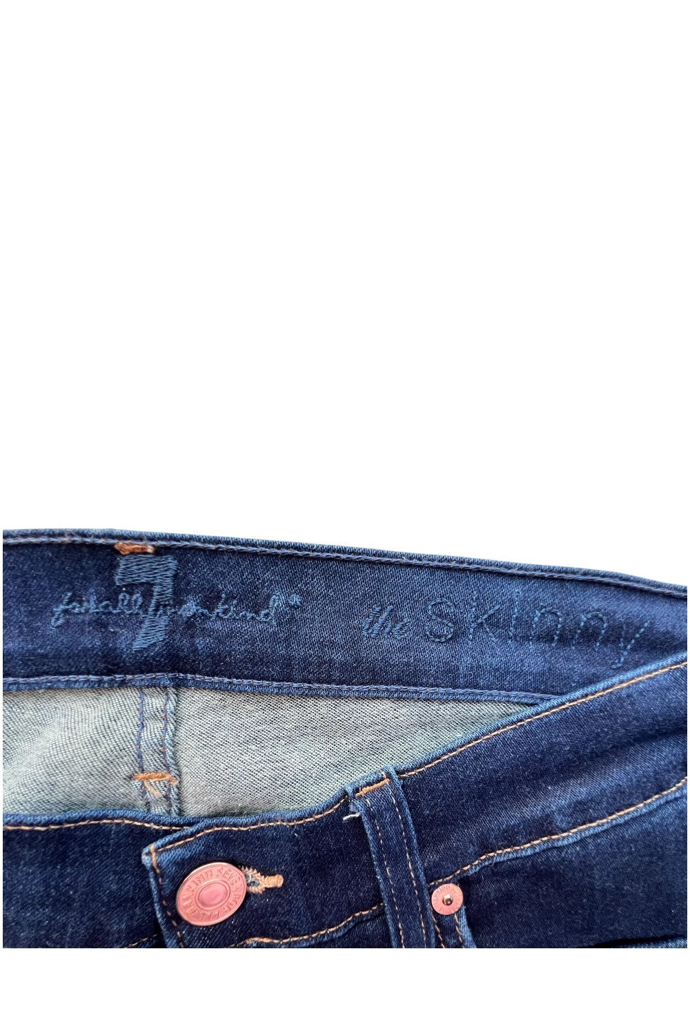 7 For All Mankind navy skinny jeans with elastic denim fabric and classic logo.