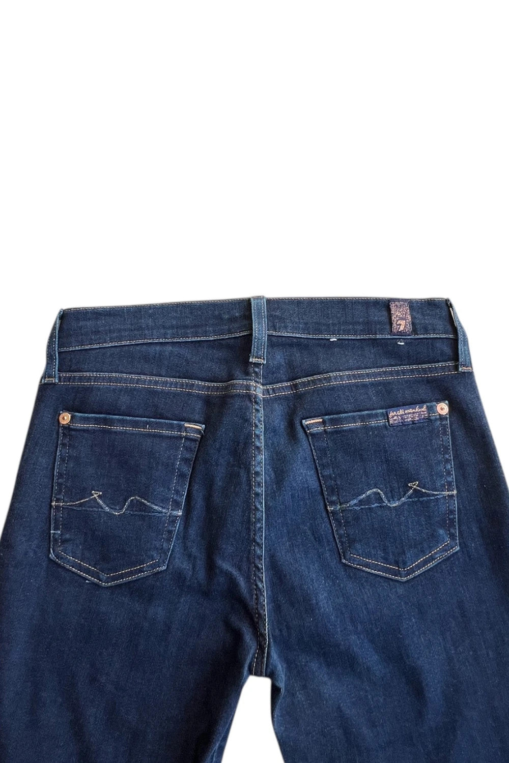 7 For All Mankind navy skinny jeans with elastic denim fabric and classic logo.