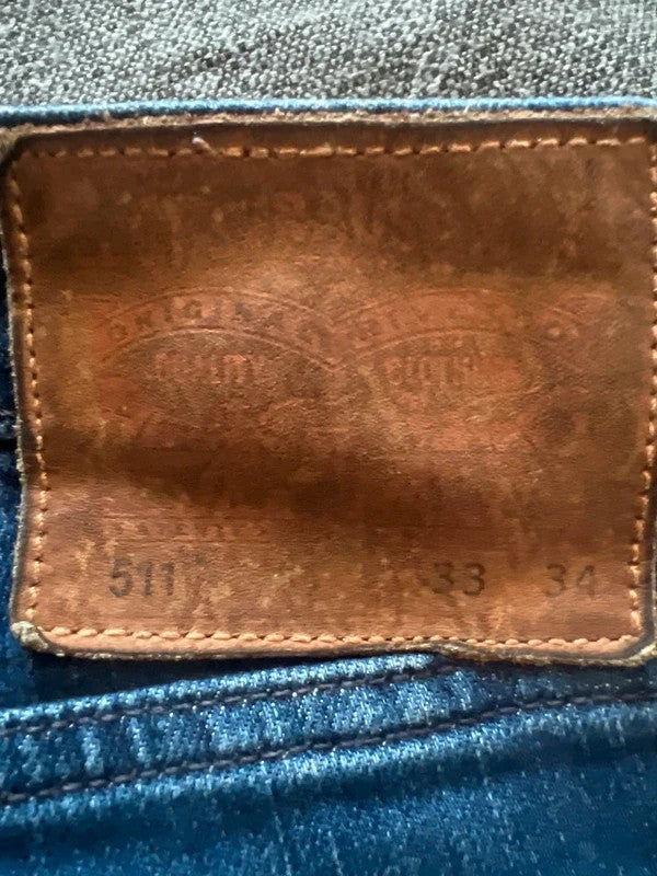 Levi's blue straight jeans 511 slim fit classic denim with logo patch.