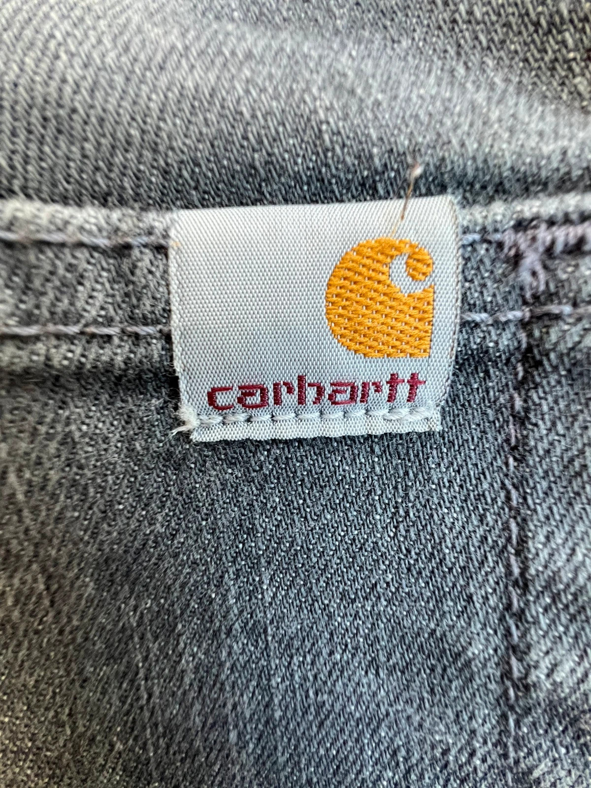 Carhartt grey straight jeans with subtle elastic blend and Y2K casual style.