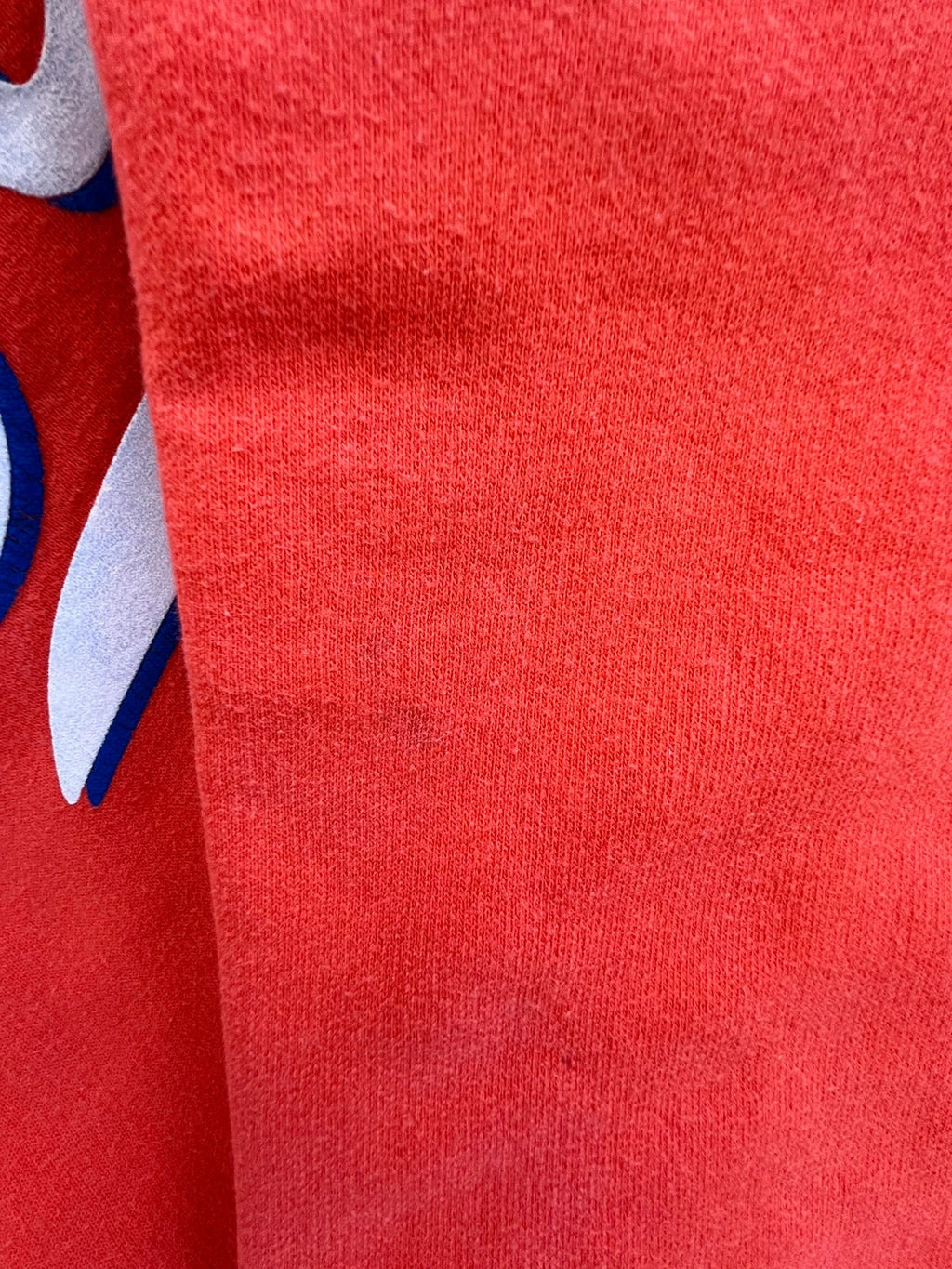 Superdry orange oversized hoodie with large vintage logo and casual streetwear style.