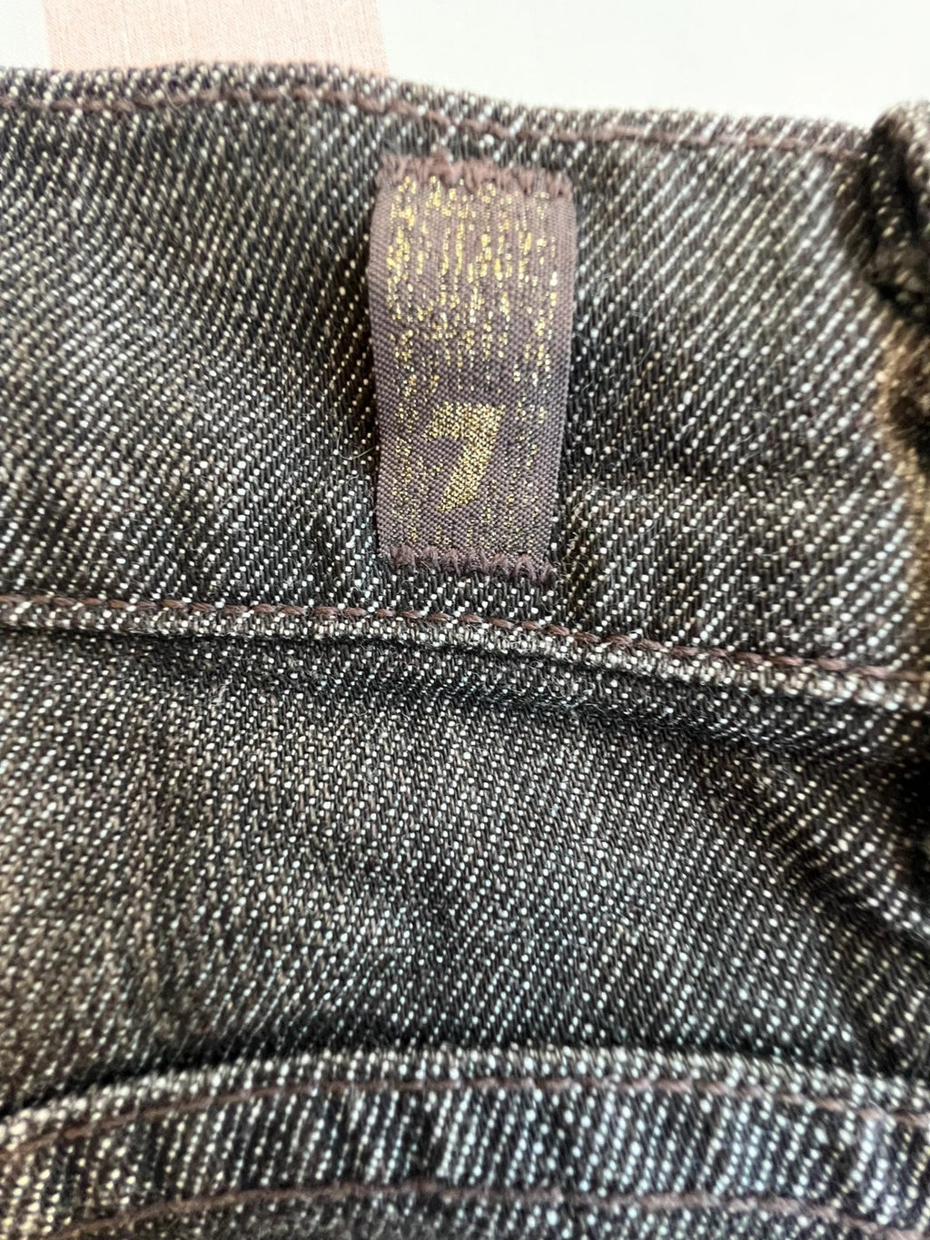 7 For All Mankind brown skinny jeans with premium denim and minimalistic design.