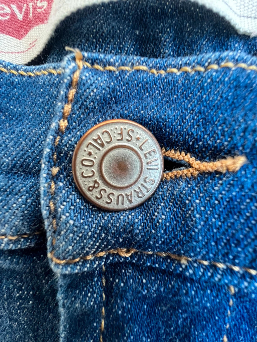 Levi's navy straight jeans with basic denim design and casual stretch fabric.