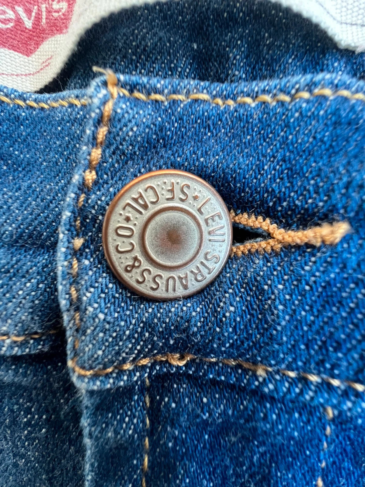 Levi's navy straight jeans with basic denim design and casual stretch fabric.