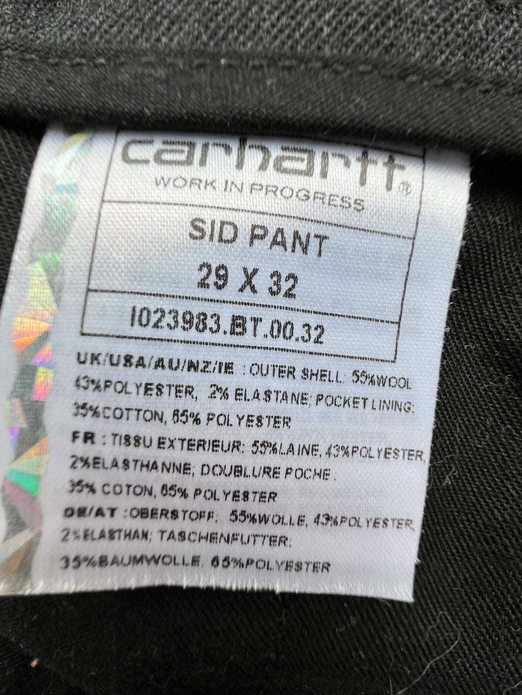 Carhartt grey chino trousers straight cut, durable fabric with subtle elastic stretch.