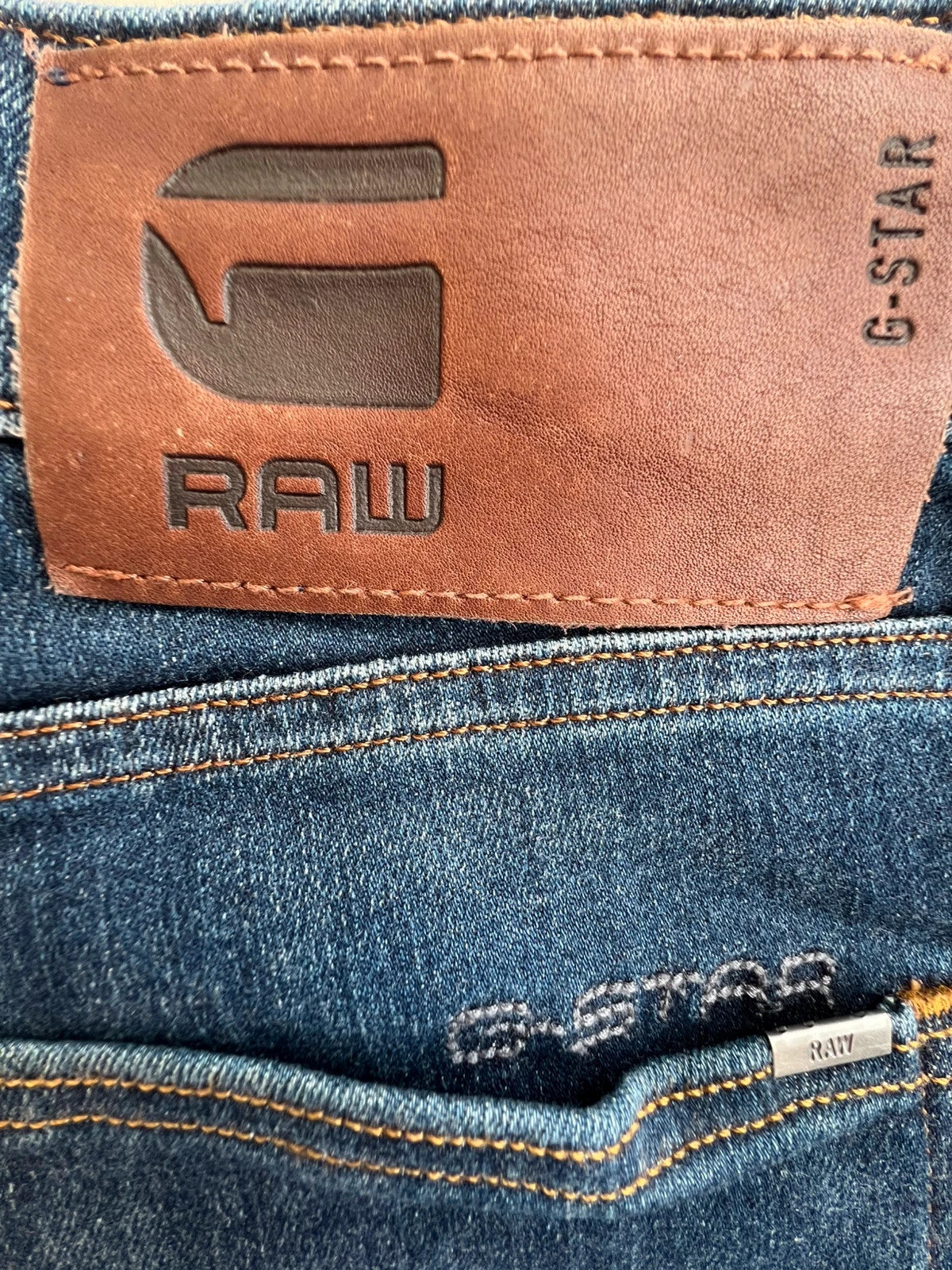 G-Star blue slim jeans 3301 with classic style and denim material.