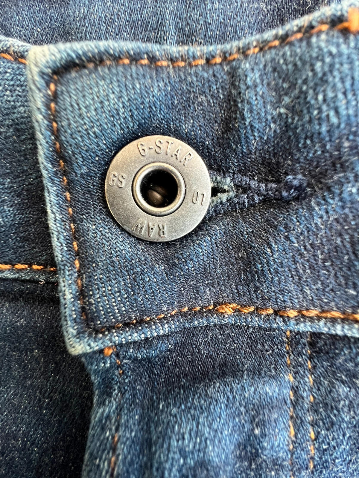 G-Star blue slim jeans 3301 with classic style and denim material.