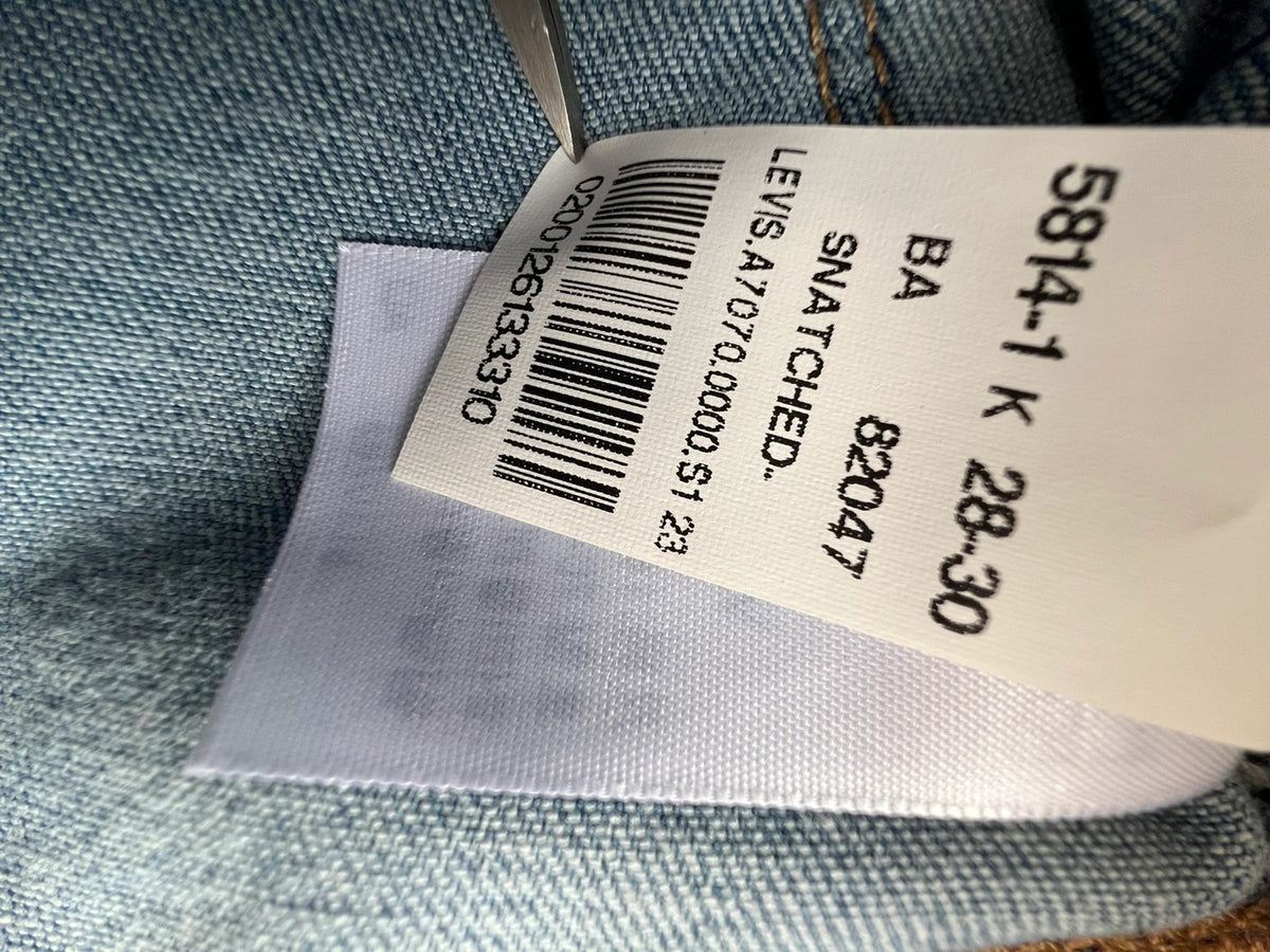 Levi's blue straight jeans with elastic denim, classic logo, slim fit design.