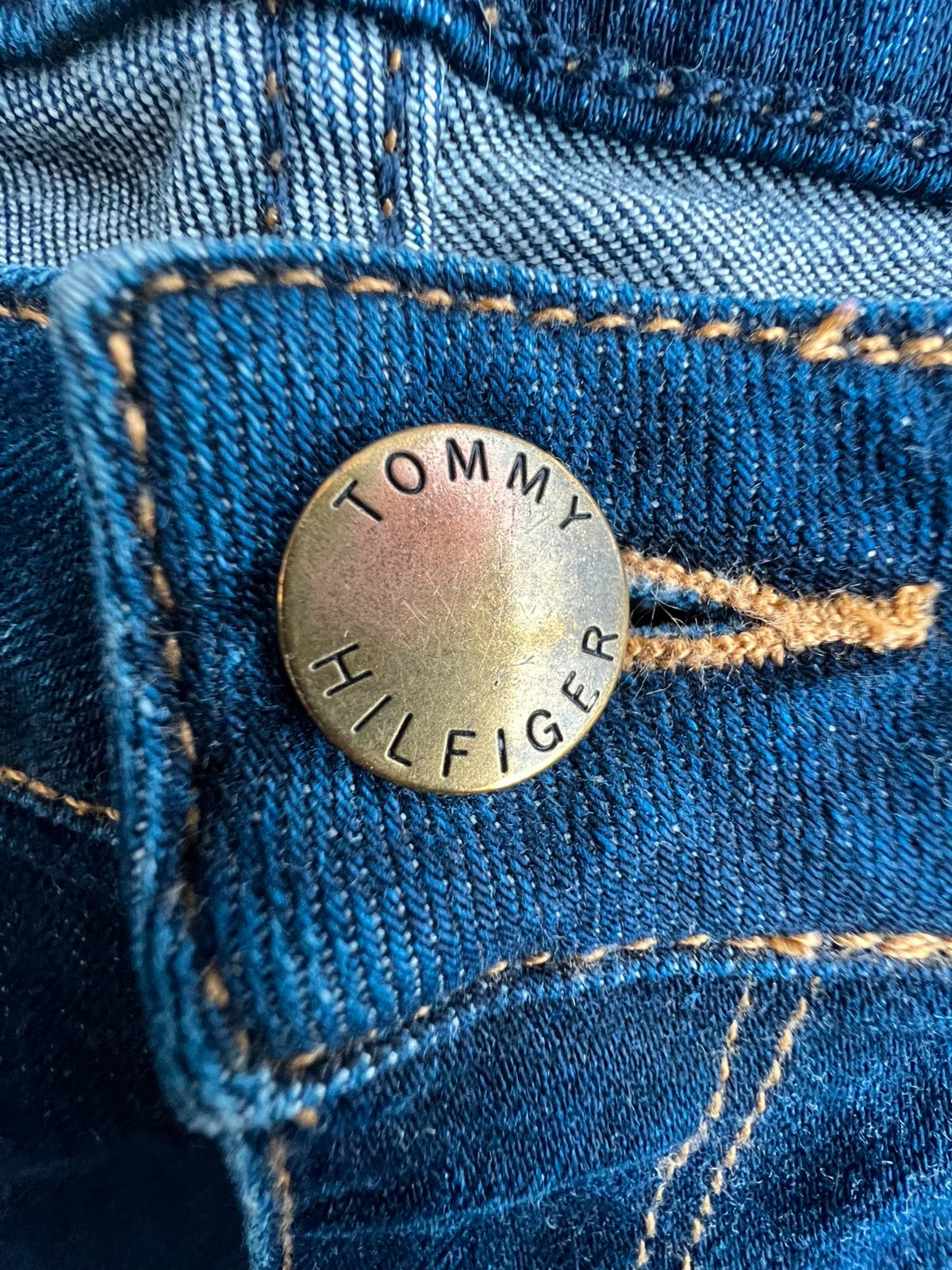 Tommy Hilfiger navy slim tapered jeans, Riverpoint model, elastic denim, casual style.