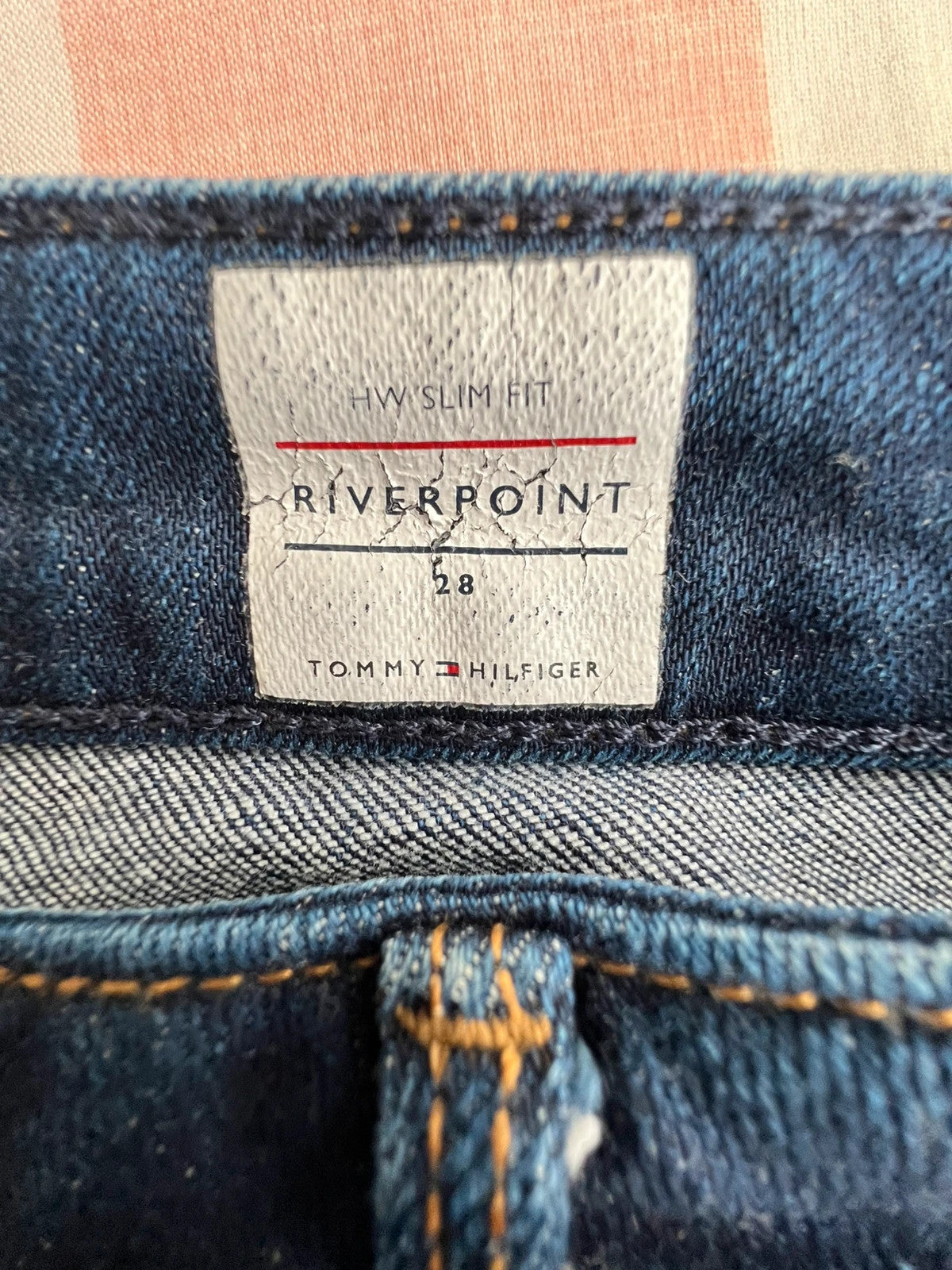 Tommy Hilfiger navy slim tapered jeans, Riverpoint model, elastic denim, casual style.