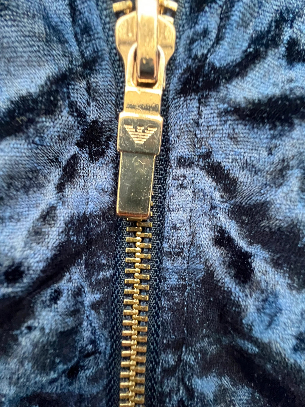 Emporio Armani navy velour hoodie with elegant embroidery and full zipper.
