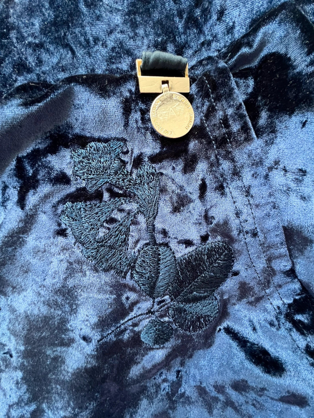 Emporio Armani navy velour hoodie with elegant embroidery and full zipper.