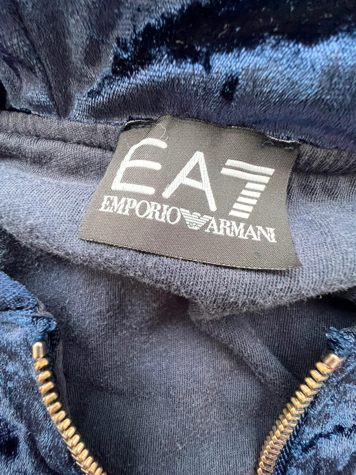 Emporio Armani navy velour hoodie with elegant embroidery and full zipper.
