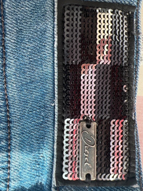 Diesel blue bootcut jeans with vintage casual style and Y2K flair.