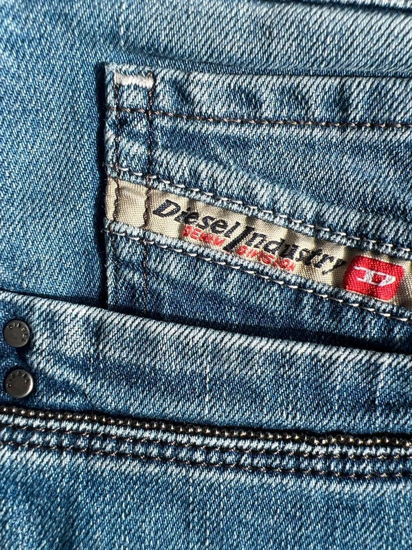 Diesel blue bootcut jeans with vintage casual style and Y2K flair.
