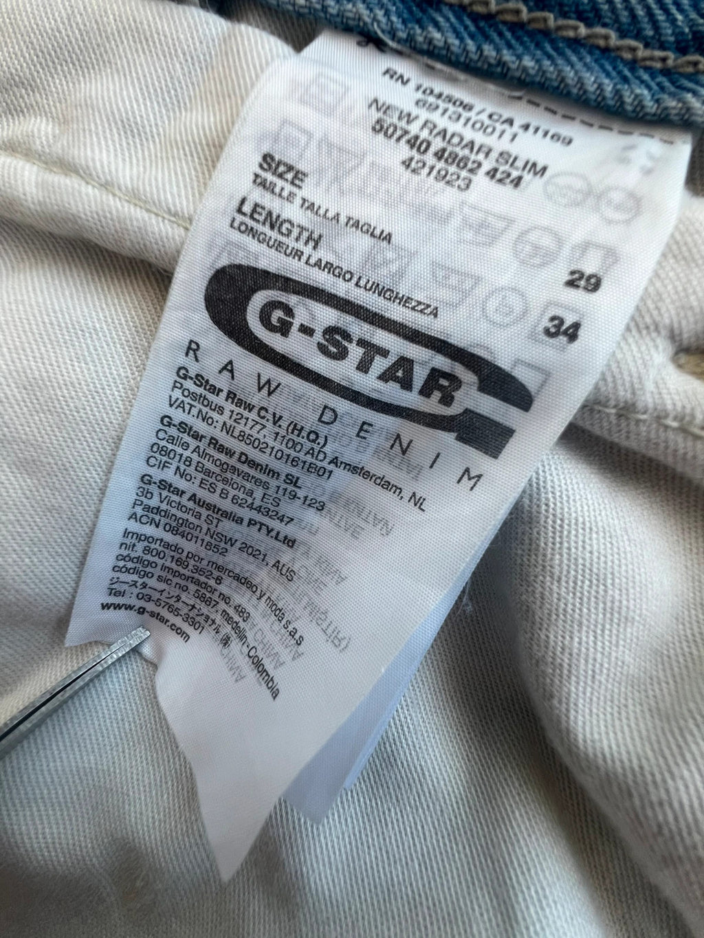 G-Star light blue straight jeans with subtle wear, Y2K style, and logo details.