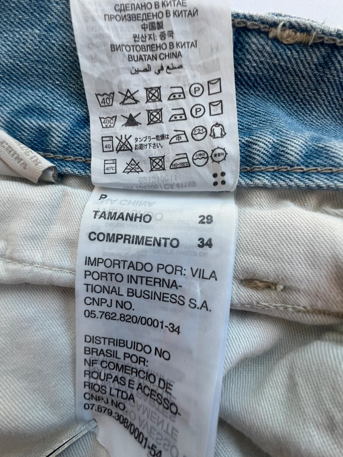 G-Star light blue straight jeans with subtle wear, Y2K style, and logo details.