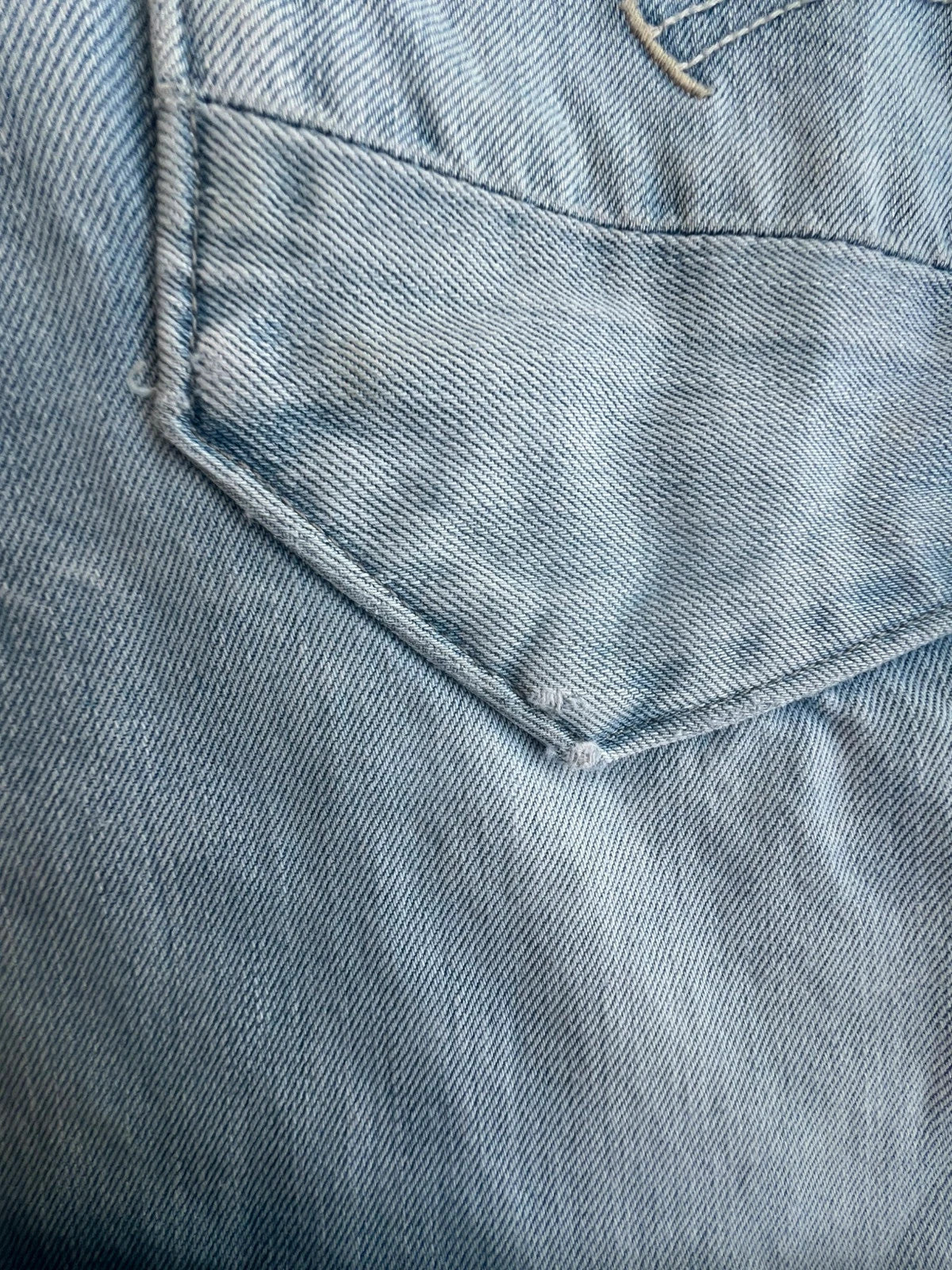 G-Star light blue straight jeans with subtle wear, Y2K style, and logo details.