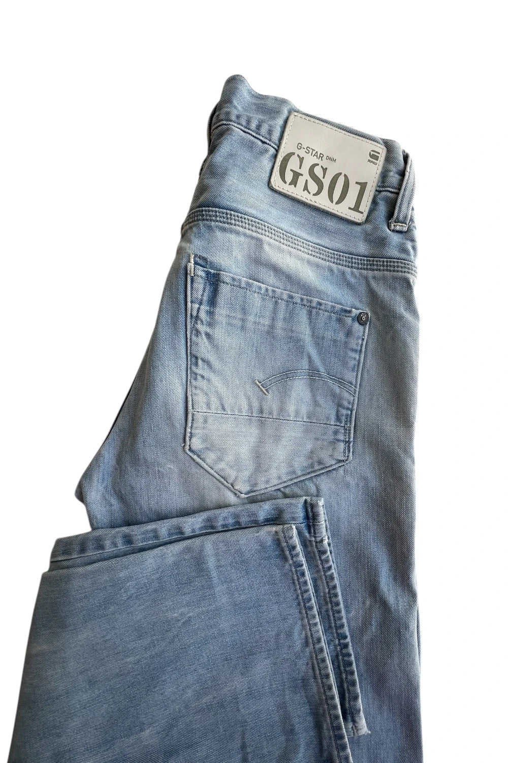 G-Star light blue straight jeans with subtle wear, Y2K style, and logo details.