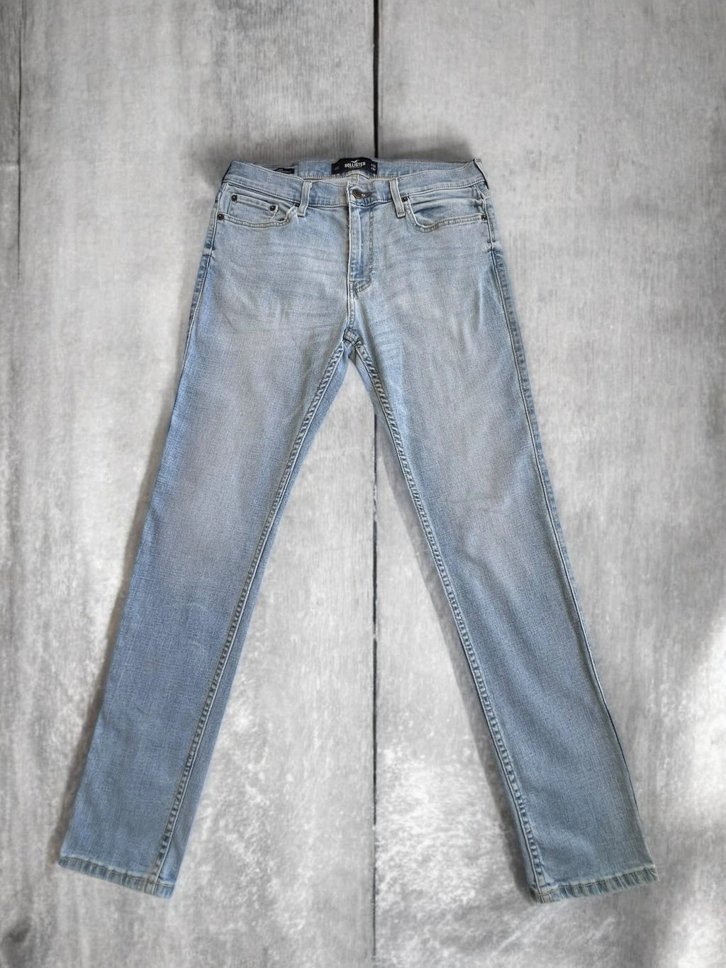 Hollister blue slim straight jeans with casual style and light denim wash.