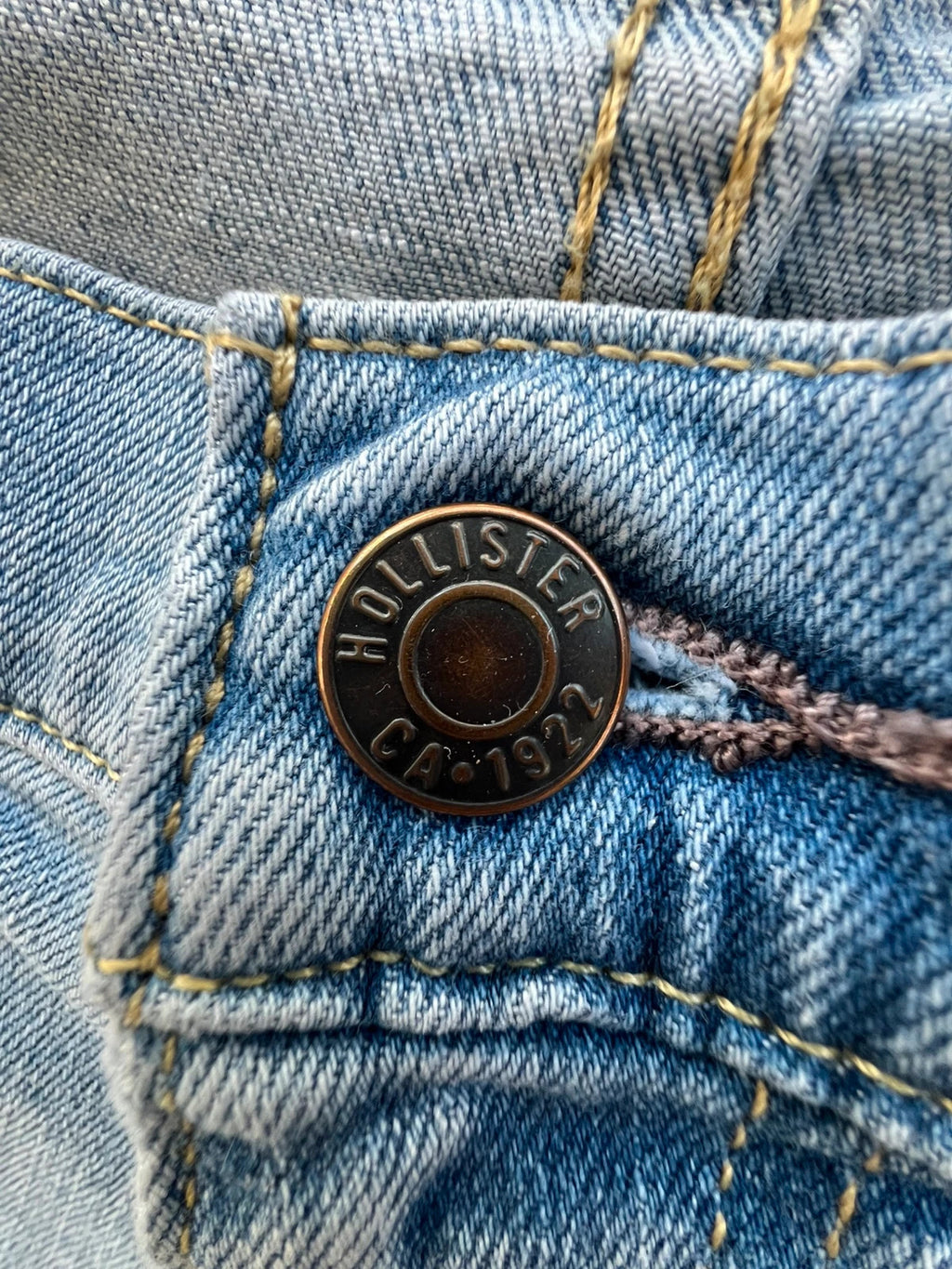 Hollister blue slim straight jeans with casual style and light denim wash.