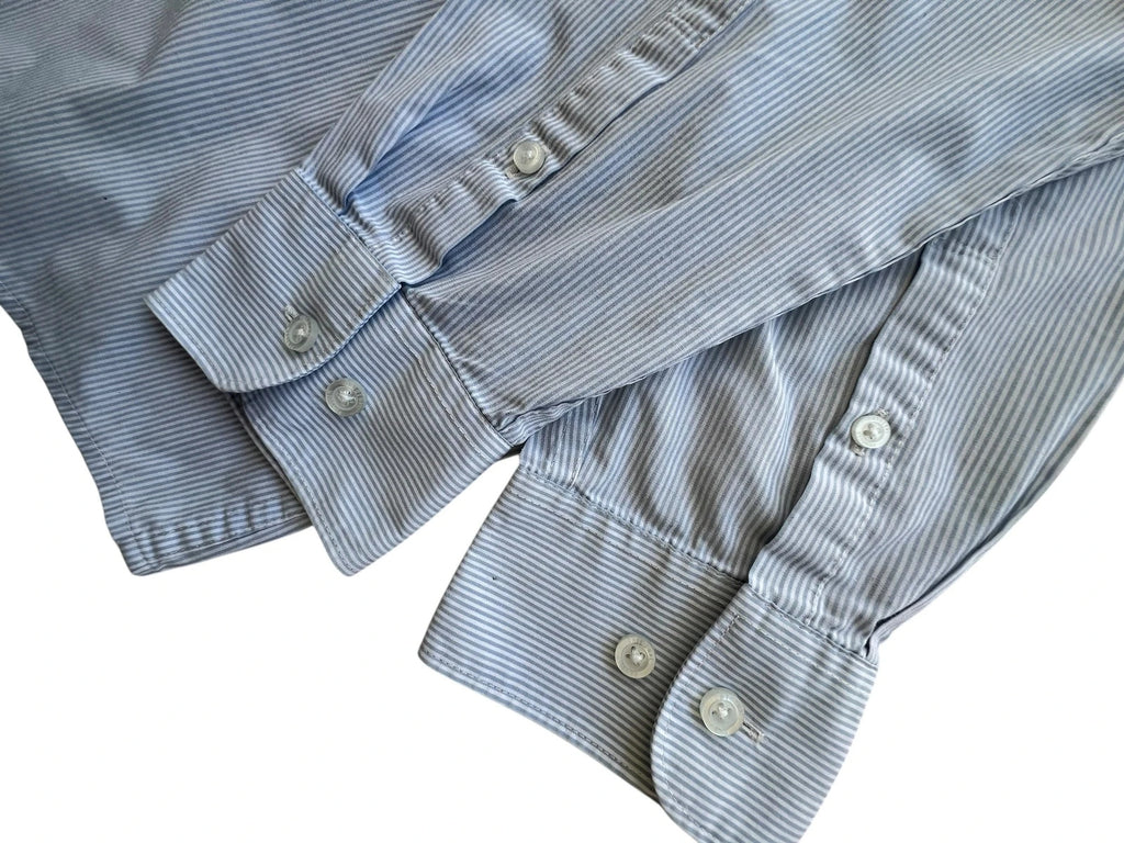 Penguin blue and white striped button down shirt with casual collar and subtle imperfections.