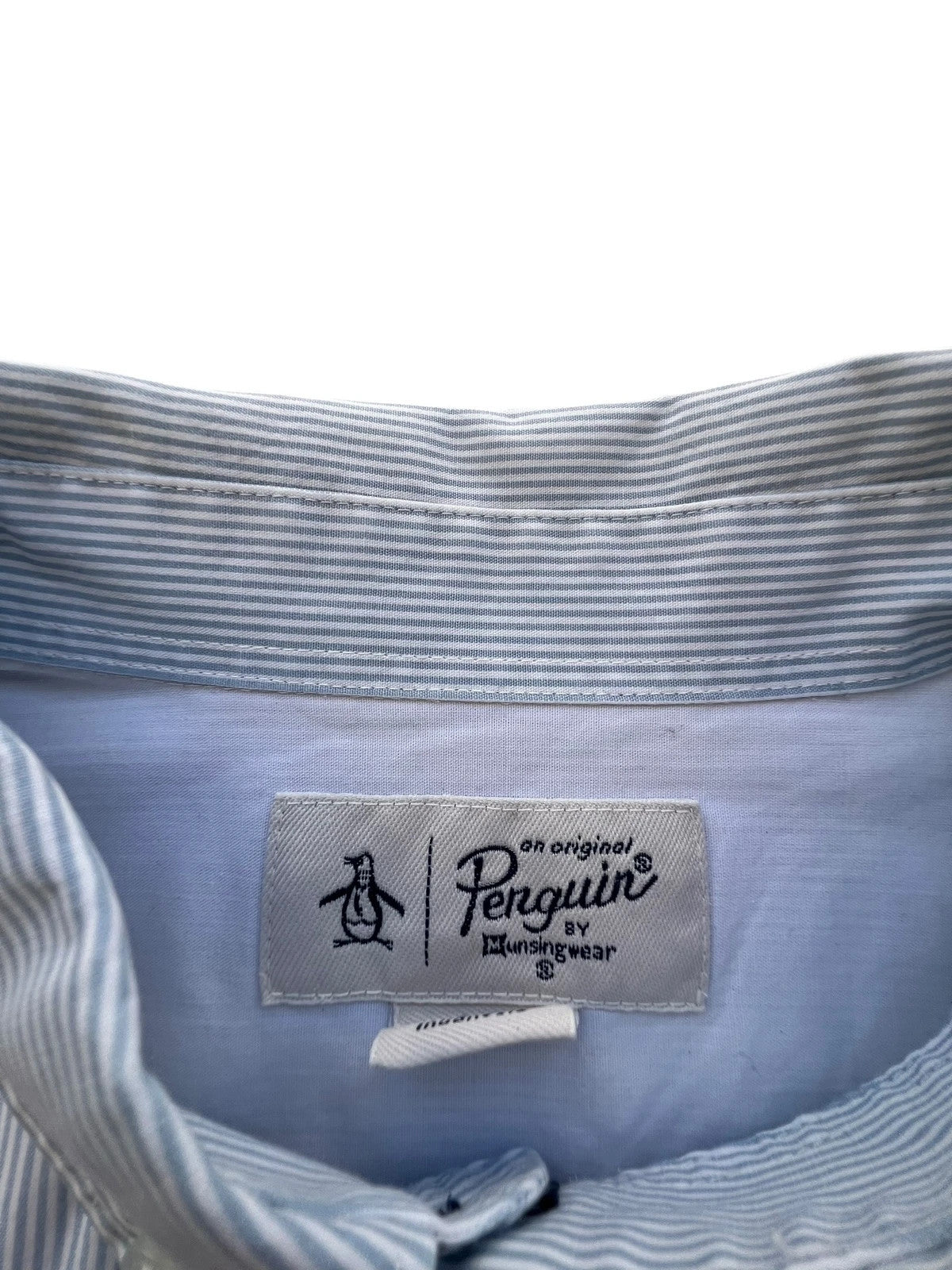 Penguin blue and white striped button down shirt with casual collar and subtle imperfections.